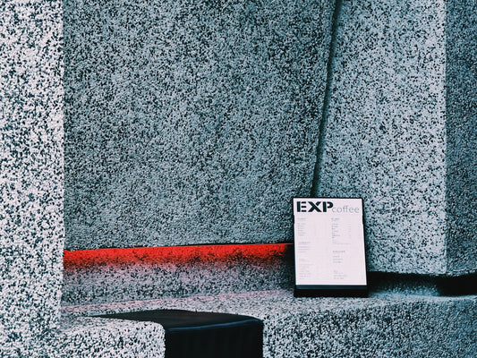 white printer paper on gray concrete wall