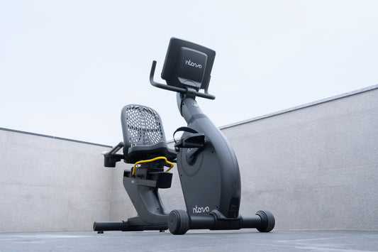 a recumbent bike with a monitor on top of it