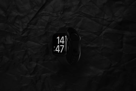 a close up of a smart watch on a black background