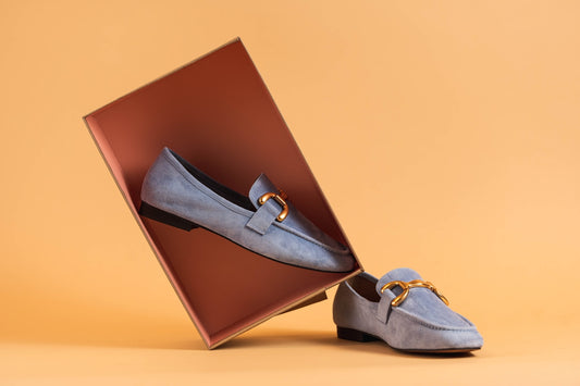 a pair of shoes sitting inside of a box