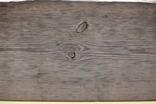 a close up of a wooden surface with knots