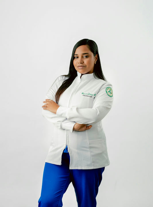 A woman in a white jacket and blue pants