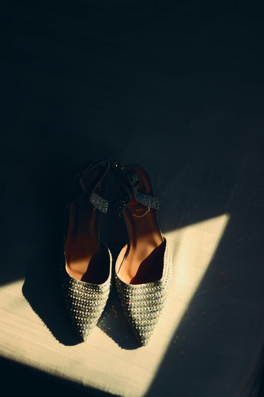 A pair of shoes sitting on top of a wooden floor