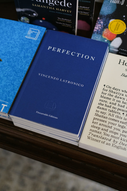 A book titled perfection is pictured.