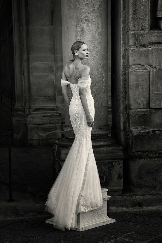 Elegant bride in a white gown with a long train