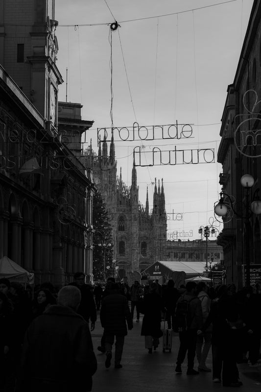 Black and white street scene with cathedral and festive lights